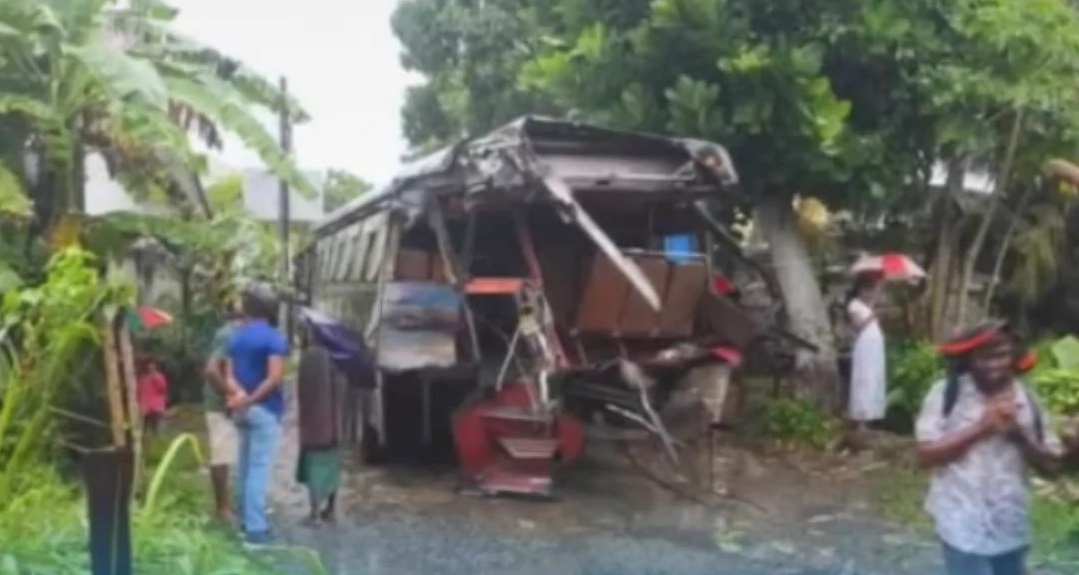 Bus carrying schoolchildren collides with a train.